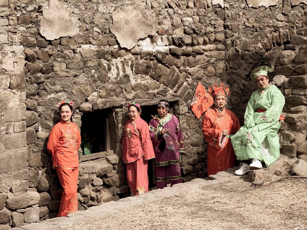 Paint By Numbers | Taiyuan - 3 Men In Green Robe Standing Beside Brown Brick Wall During Daytime