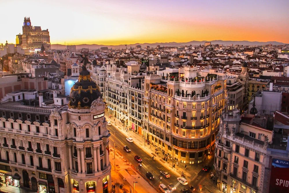 Paint By Numbers | Madrid - Aerial Photography Of Vehicles Passing Between High Rise Buildings