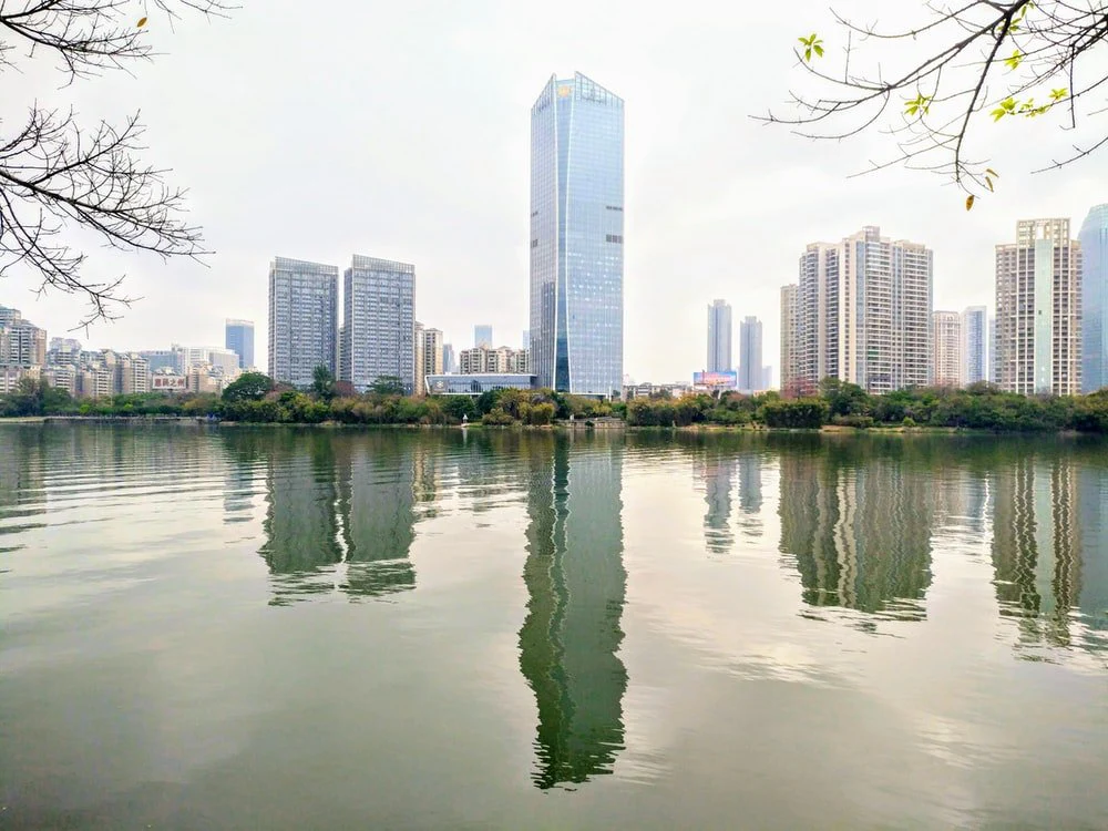 Paint By Numbers | Huizhou - Body Of Water Near City Buildings During Daytime