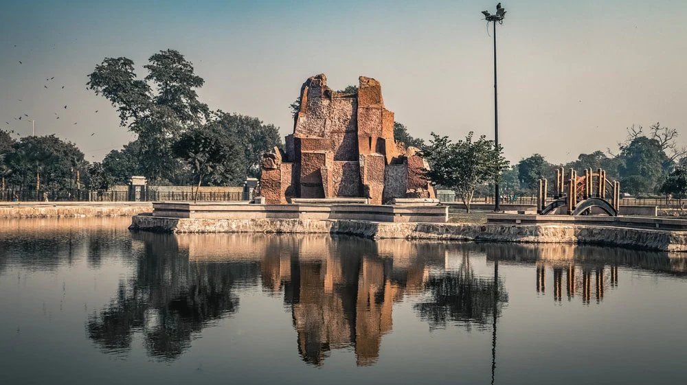 Paint By Numbers | Lahore - Brown Concrete Building Near Body Of Water During Daytime