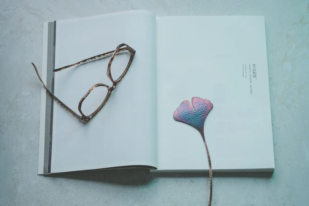 Paint By Numbers | Brown Eyeglasses On Opened Book
