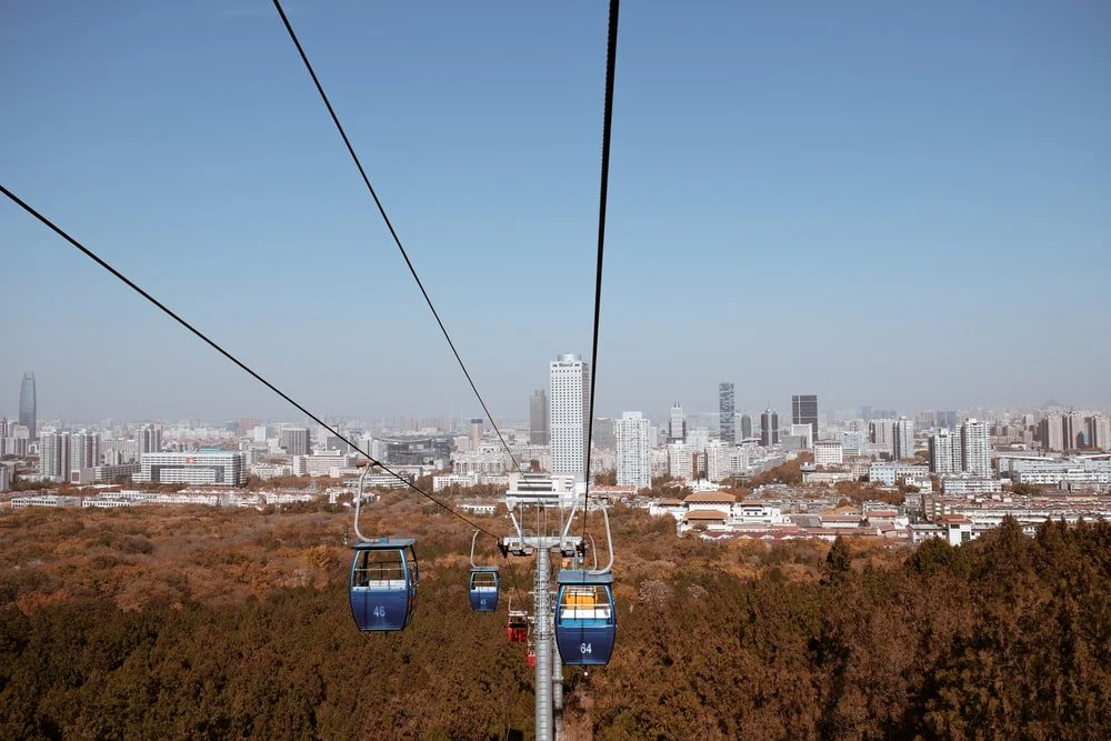 Paint By Numbers | Jinan - Cable Cars Over City Buildings During Daytime