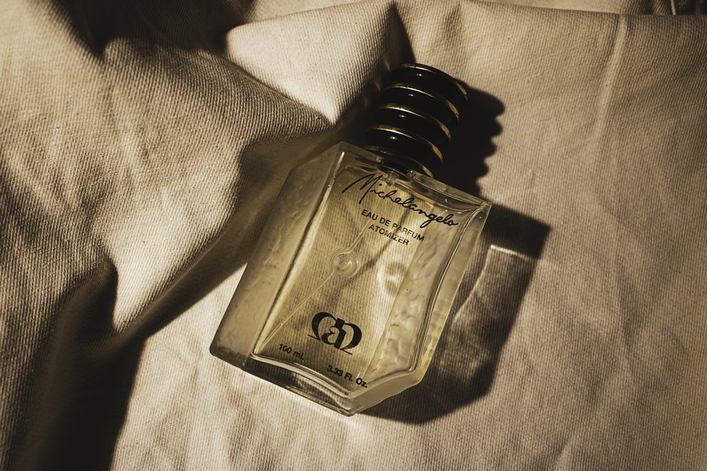 Paint By Numbers | Gold Perfume Bottle On White Textile