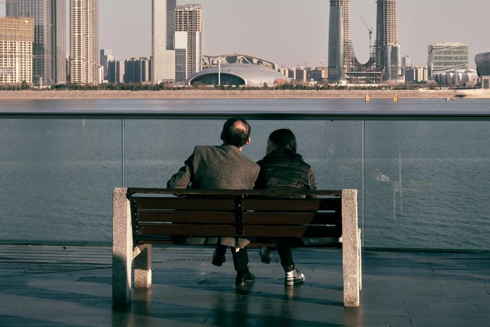 Paint By Numbers | Hangzhou - Man And Woman Sitting On Brown Wooden Bench