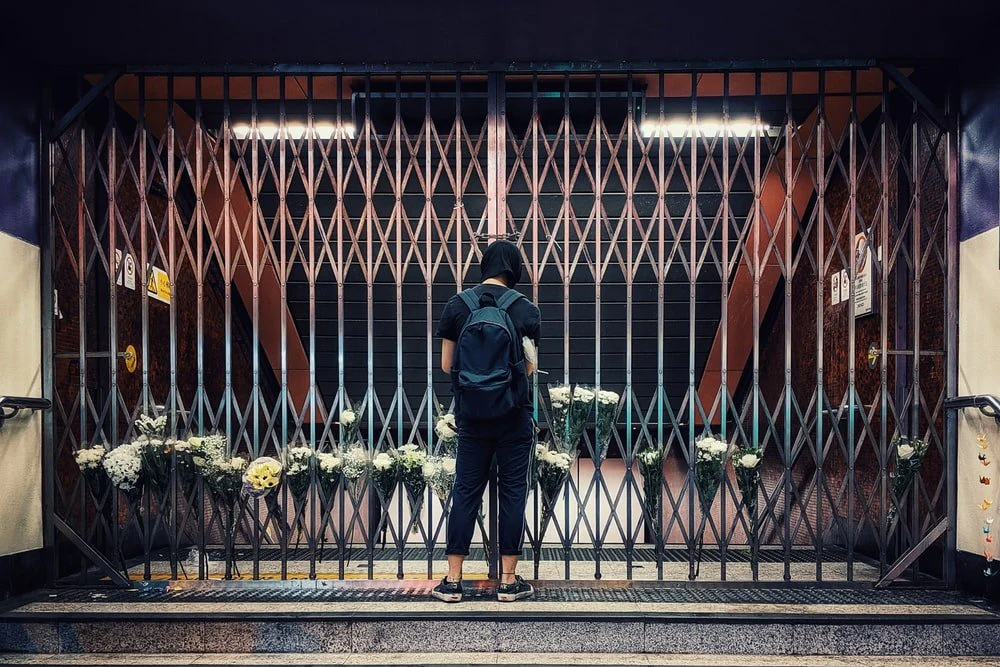 Paint By Numbers | Man In Black Jacket And Blue Denim Jeans Standing In Front Of Black Metal Fence