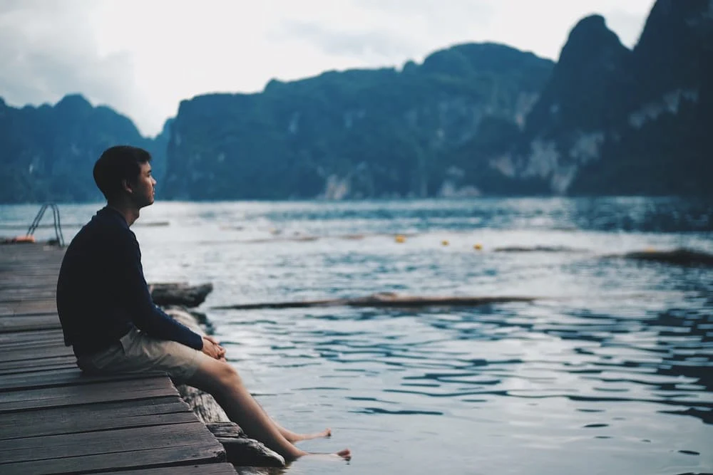 Paint By Numbers | Sūrat - Man In Black Jacket Sitting On Wooden Dock During Daytime