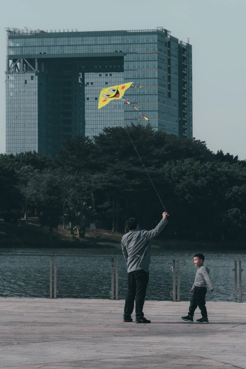 Paint By Numbers | Dongguan - Man In White Long Sleeve Shirt And Gray Pants Fishing On Lake During Daytime