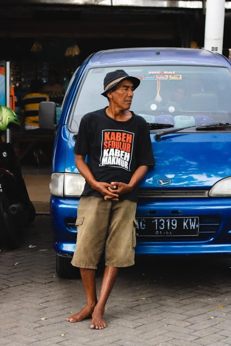 Paint By Numbers | Surabaya - Man Leaning On Blue Vehicle During Daytime