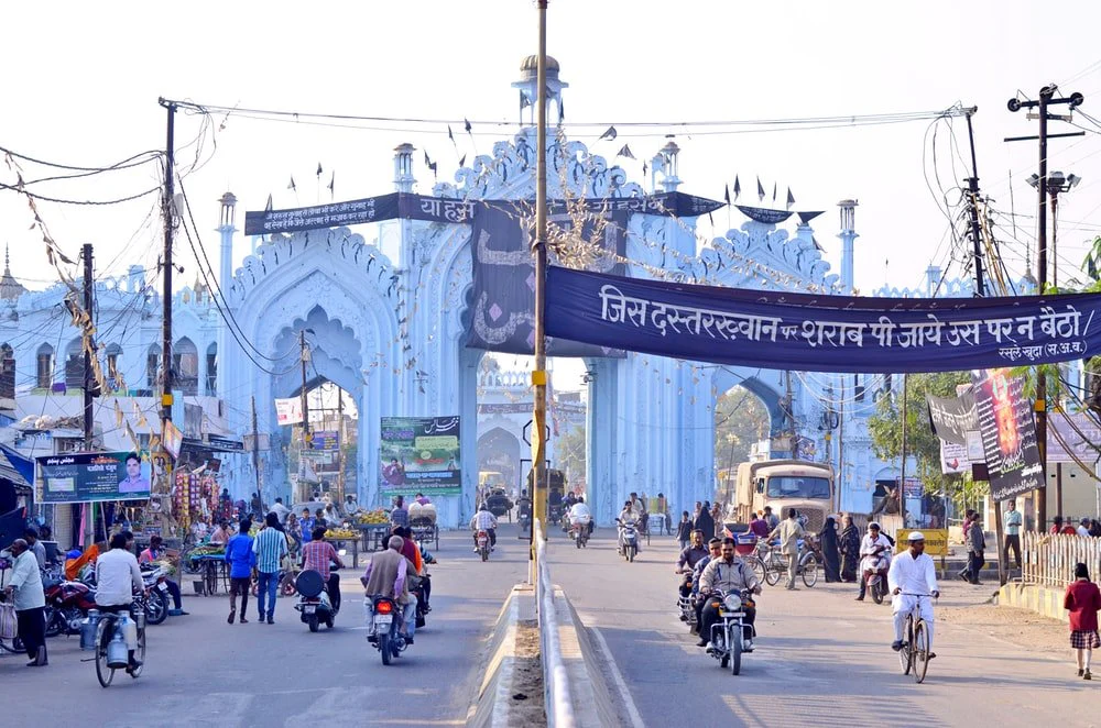Paint By Numbers | Lucknow - People Riding Motorcycle On Road Near Blue And White Concrete Building During Daytime