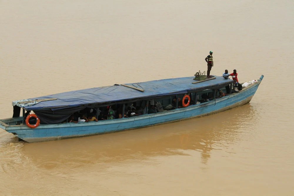 Paint By Numbers | Abidjan - People Riding On Blue And White Boat On Water During Daytime