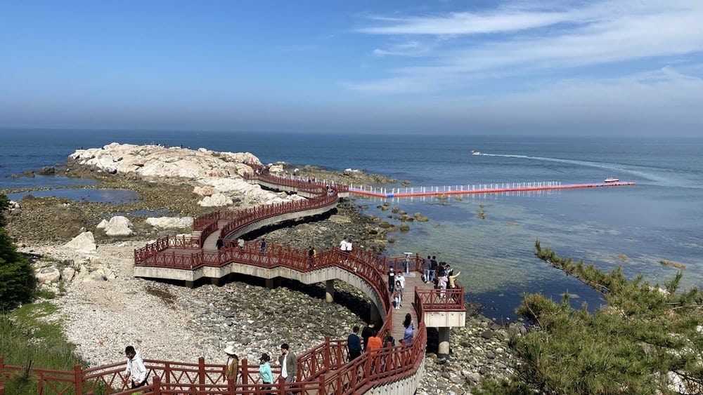 Paint By Numbers | Yantai - People Walking On Brown Concrete Bridge Near Body Of Water During Daytime