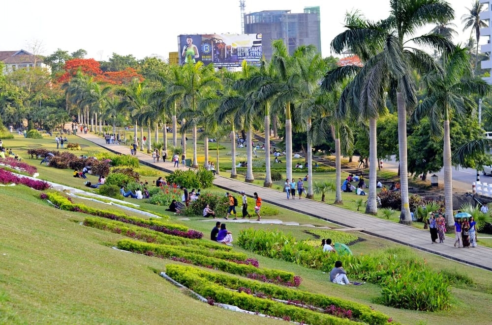 Paint By Numbers | Rangoon - People Walking On Green Grass Field Near Green Trees And Buildings During Daytime