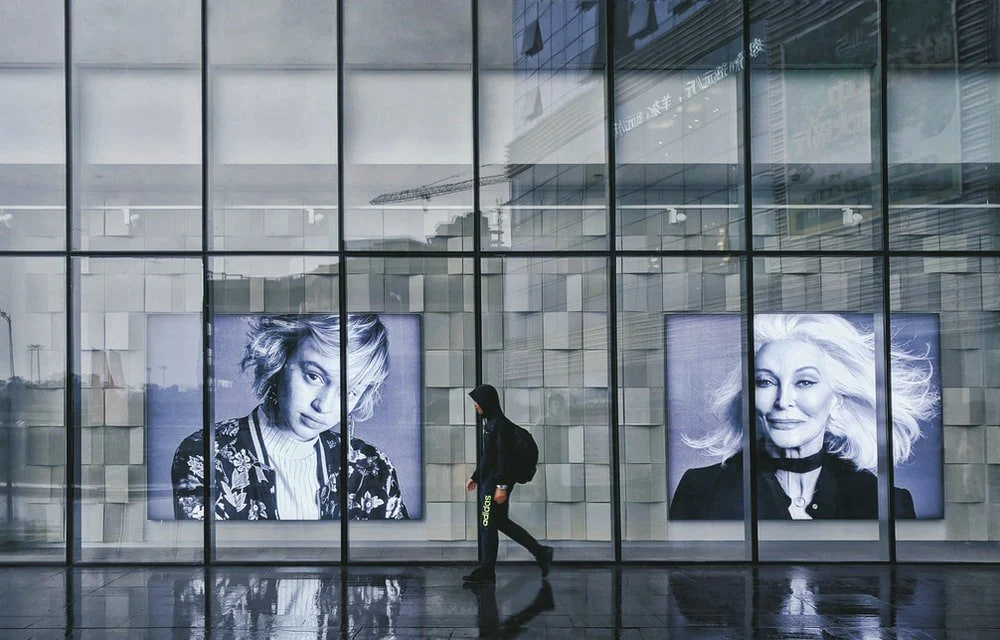 Paint By Numbers | Luzhou - Person Wearing Hoodie Walking Beside Portrait Of Two Women