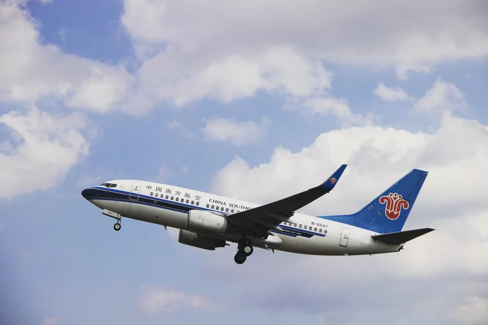 Paint By Numbers | Shenyang - White And Blue Airplane Under Blue Sky During Daytime