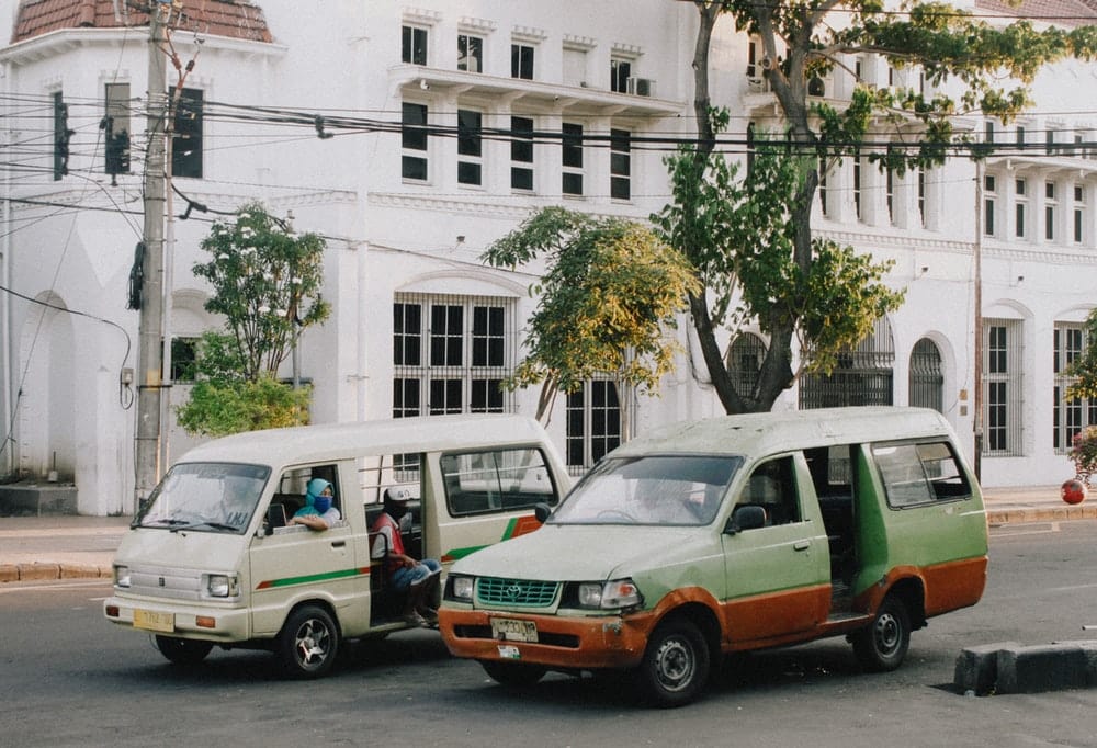 Paint By Numbers | White And Green Van Parked Beside White Concrete Building During Daytime