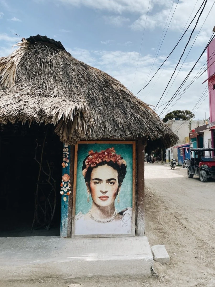 Paint By Numbers | Woman In Blue Shirt Standing Under Brown Wooden Nipa Hut During Daytime